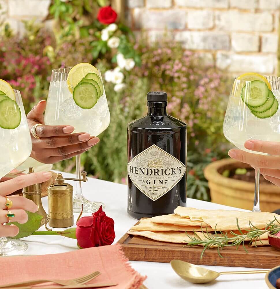 friends raising a toast with Cucumber Lemonade cocktail